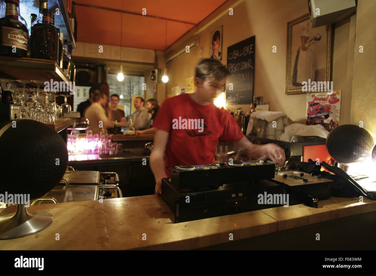 Disc jockey playing music in restaurant, Germany Stock Photo Alamy