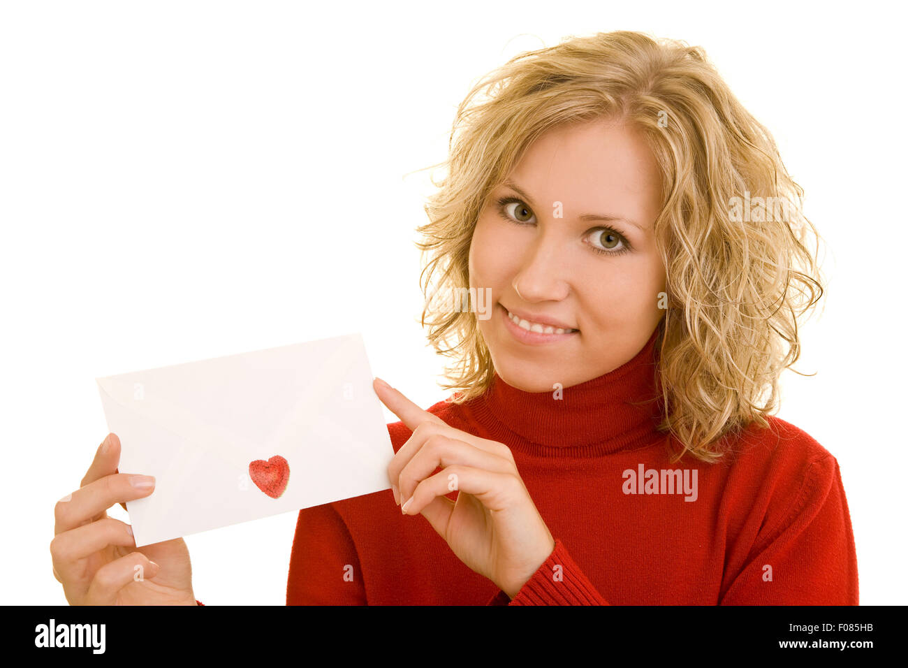 Happy young woman holding a love letter Stock Photo