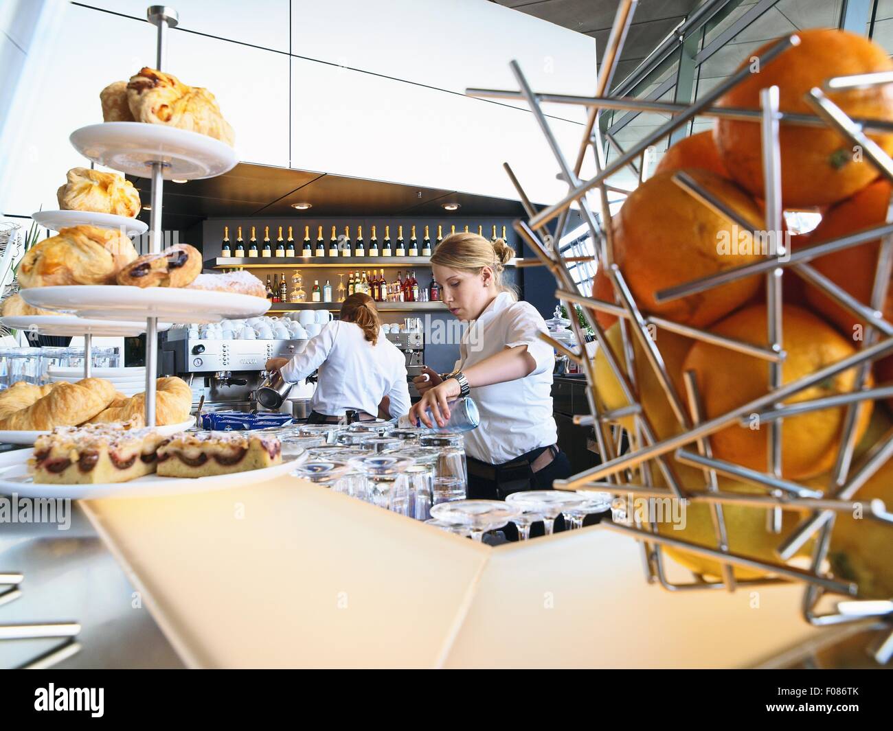 Two waitress working at coffee bar in BMW World, Munich, Germany Stock Photo