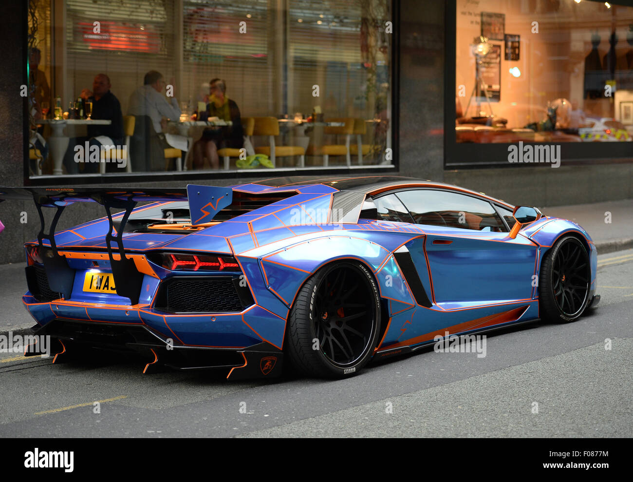 A Lamborghini Aventador with a Tron design cutomised by Oakley Design  parked on double yellow lines in Manchester City Centre Stock Photo - Alamy