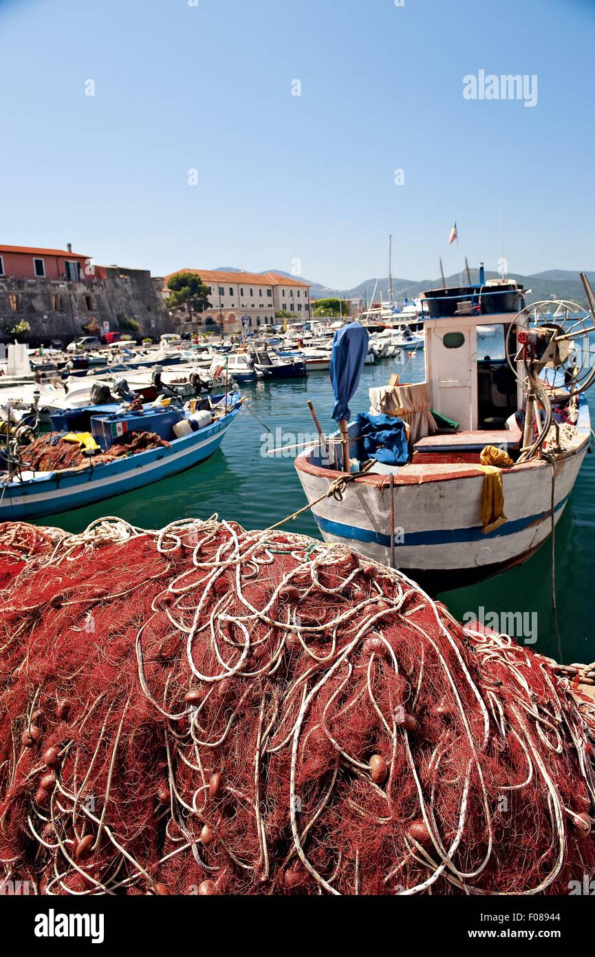 Fishing boats with jumbled fishing nets at Portoferraio port, Elba Island, Tuscany, Italy Stock Photo