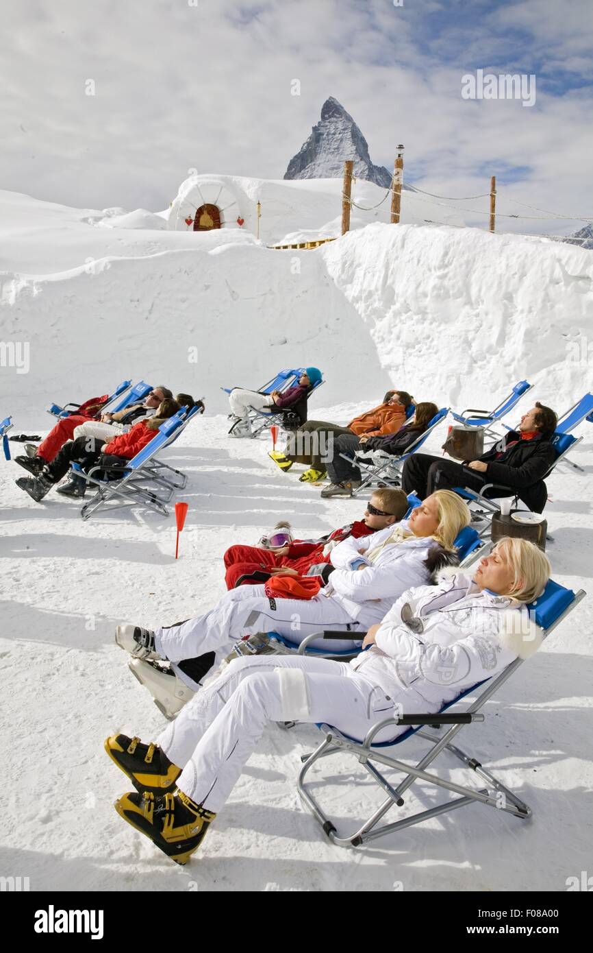 People having sunbath on Igloo village in Zermatt, Valais, Switzerland