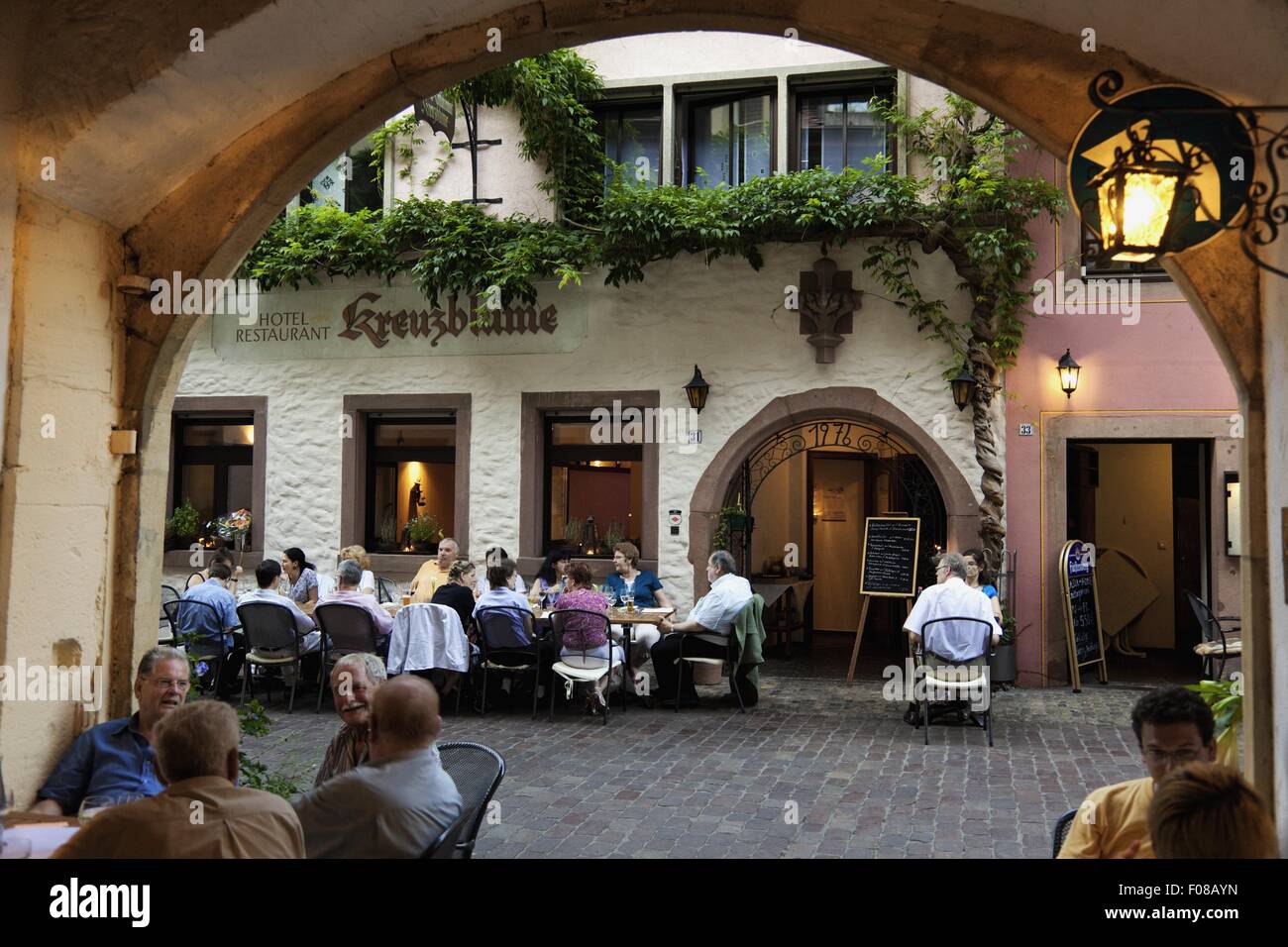Guests sitting outside Restaurant finial in Freiburg, Black Forest