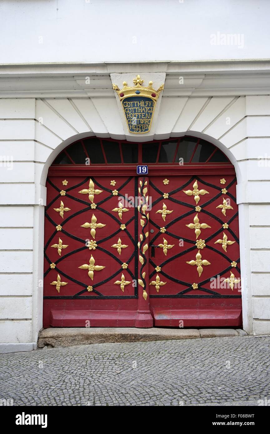 Entrance of red Baroque door in Gorlitz, Saxony, Germany Stock Photo