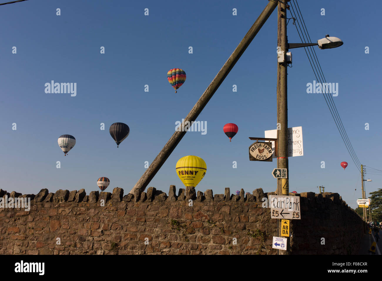 Balloons float overhead during the mass liftoff by balloons at