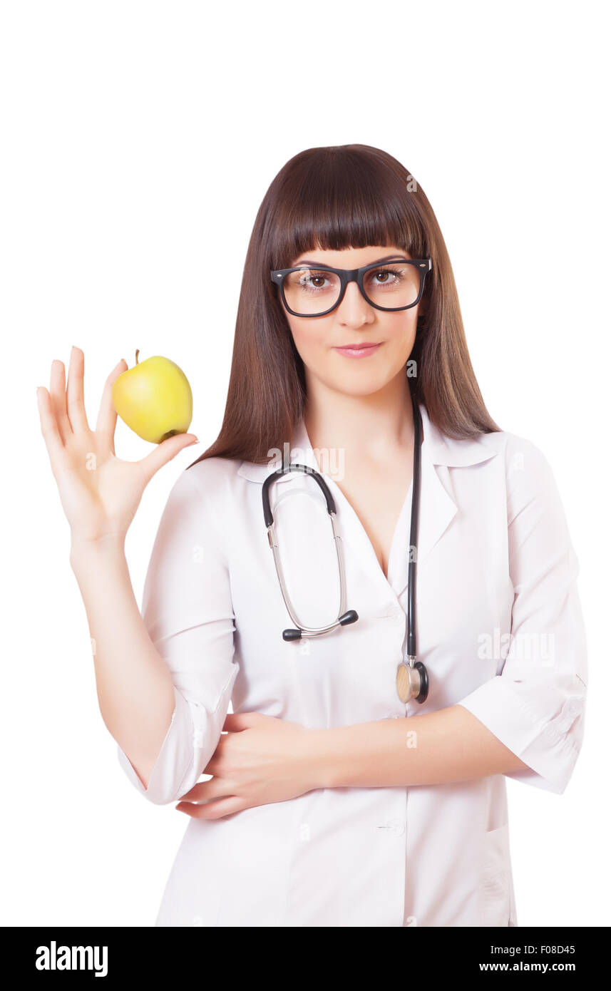 Woman in a white lab coat with apple, isolated on white background ...