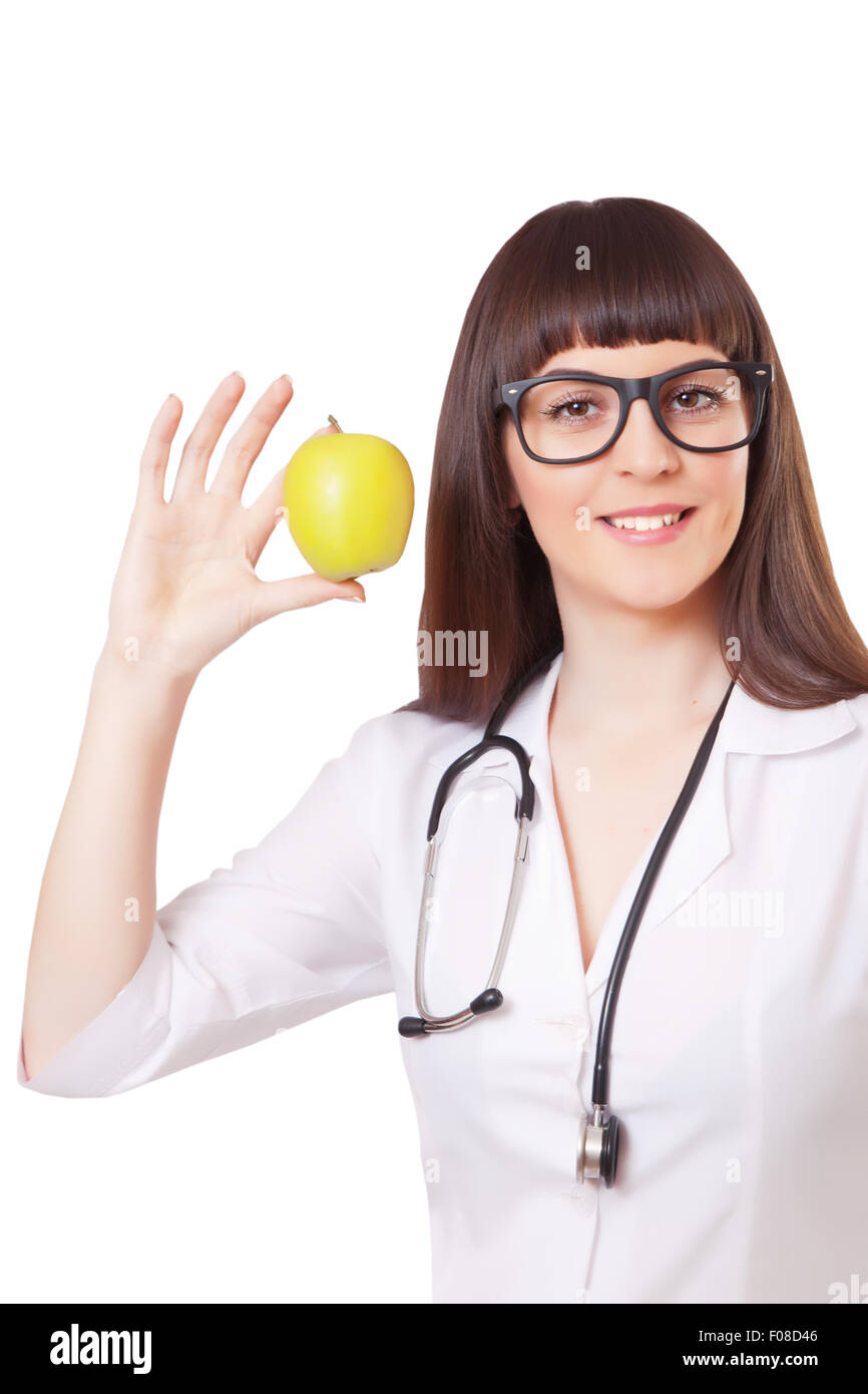 Woman in a white lab coat with apple, isolated on white background ...