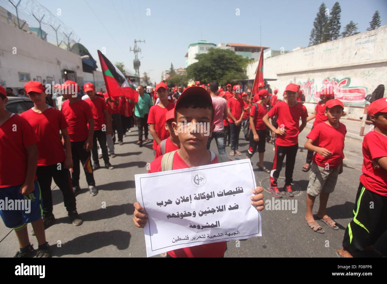 Gaza City, Gaza Strip, Palestinian Territory. 10th Aug, 2015. Palestinians supporters of the Popular Front for the Liberation of Palestine (PFLP) take part in a protest against the reduction of educational programs given by the United Nations Relief and Works Agency (UNRWA) in Gaza City, on August 10, 2015. The Deputy Commissioner-General Sandra Mitchell, explained the crisis' potential consequences for beneficiaries and the efforts UNRWA is undertaking to bridge the current deficit of US$ 101 million of its General Fund. In a town hall meeting with staff members, she stated that UNRWA is Stock Photo
