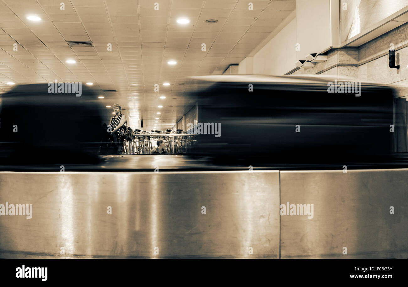 Suitcases on airport baggage carousel. Stock Photo