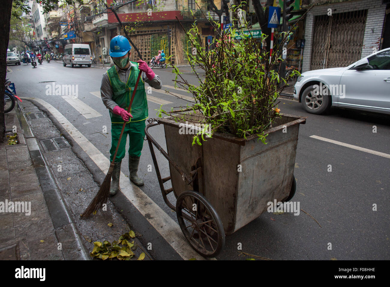 street sweeper at work in Hanoi city, Vietnam Stock Photo