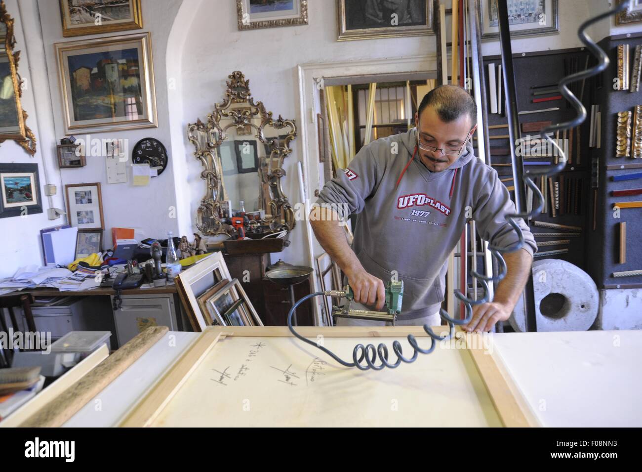 Milan, (Italy), artisan framer and restorer of furniture Stock Photo
