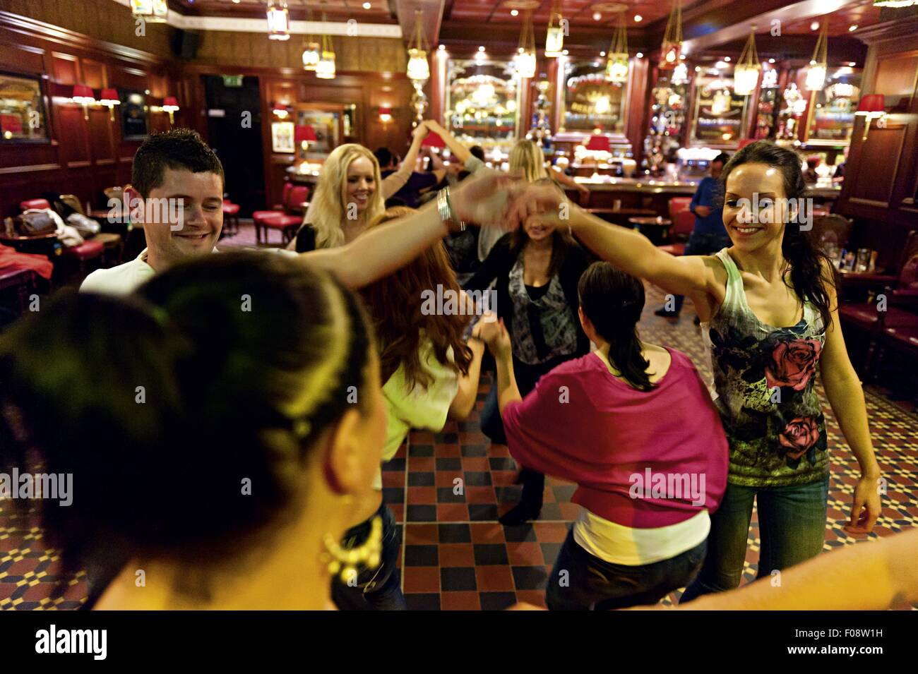 Happy people dancing in Dark Horse Pub, Belfast, Ireland Stock Photo