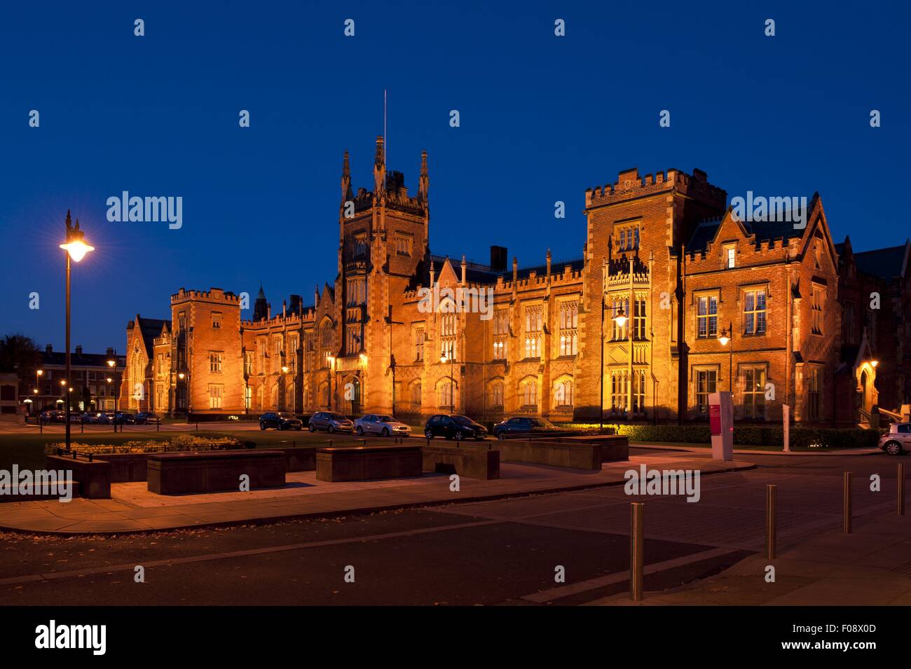 View of illuminated Belfast Queen's University at night, Belfast, Ireland, UK Stock Photo