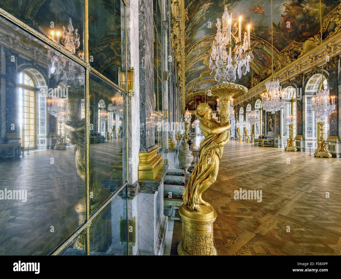Hall of Versailles Palace with mirrors, frescoes and chandelier in