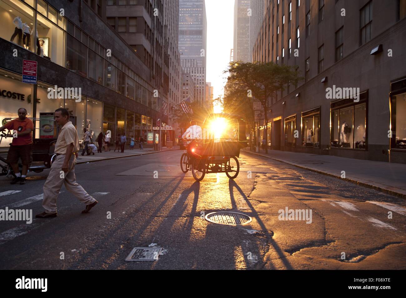 Horse carriage on street with people at sunset in New York, USA Stock Photo