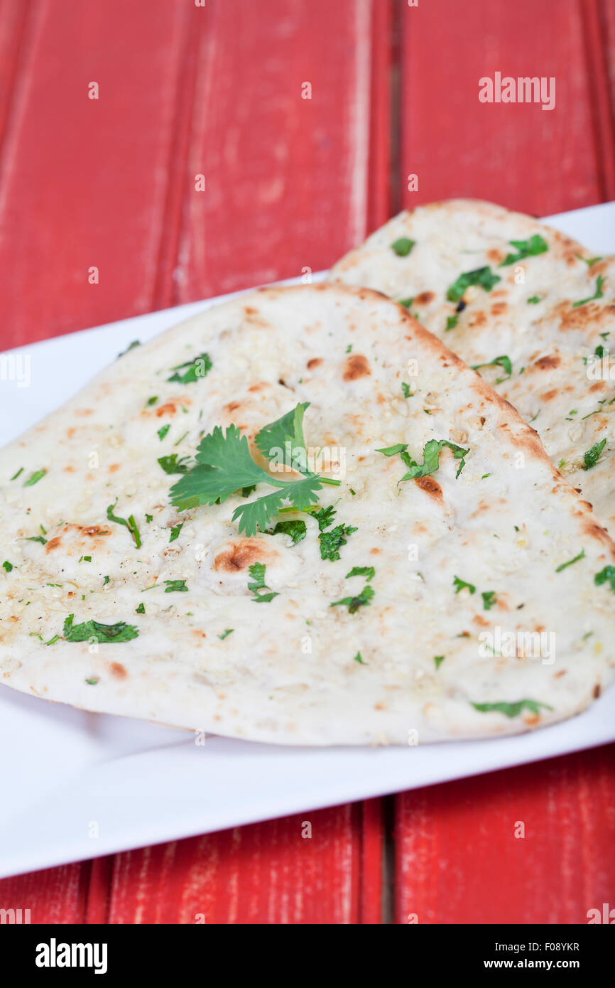 Traditional fresh baked naan bread with corriander Stock Photo Alamy
