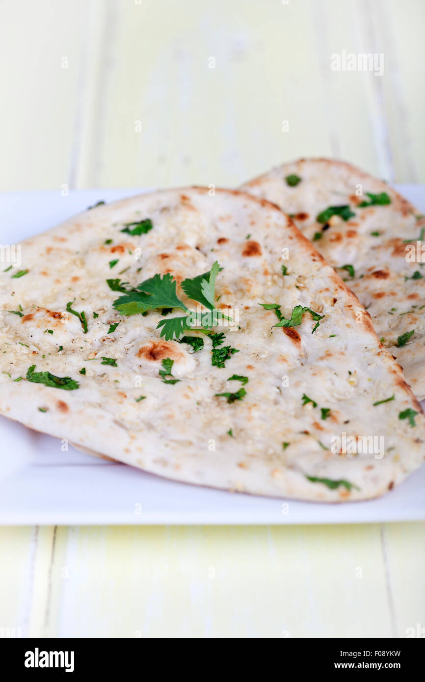 Traditional fresh baked naan bread with corriander Stock Photo Alamy