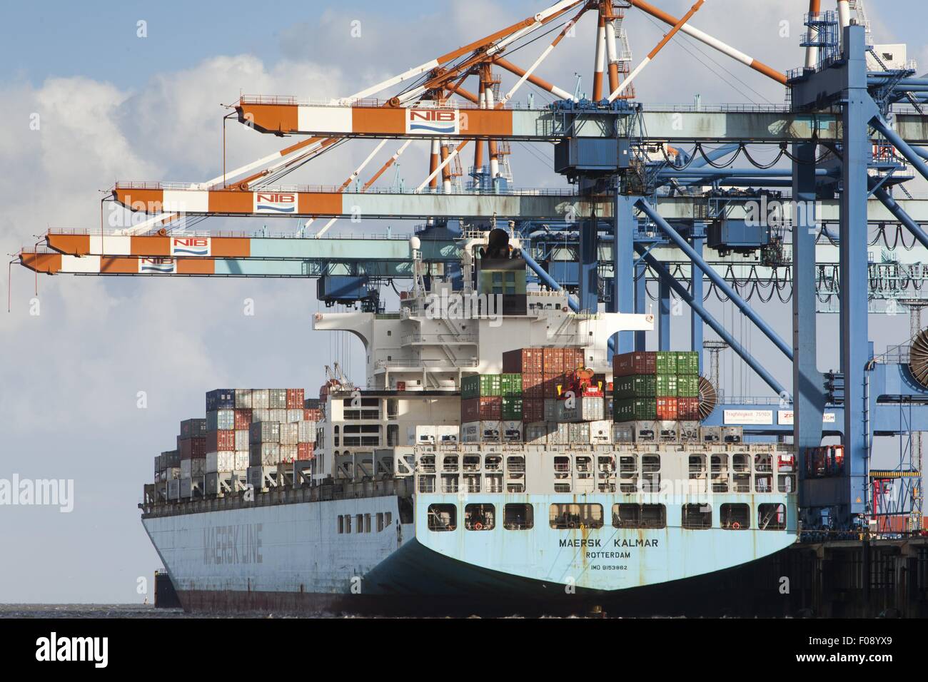 Containers being loaded on ship with cranes, Bremerhaven, Bremen, Germany Stock Photo