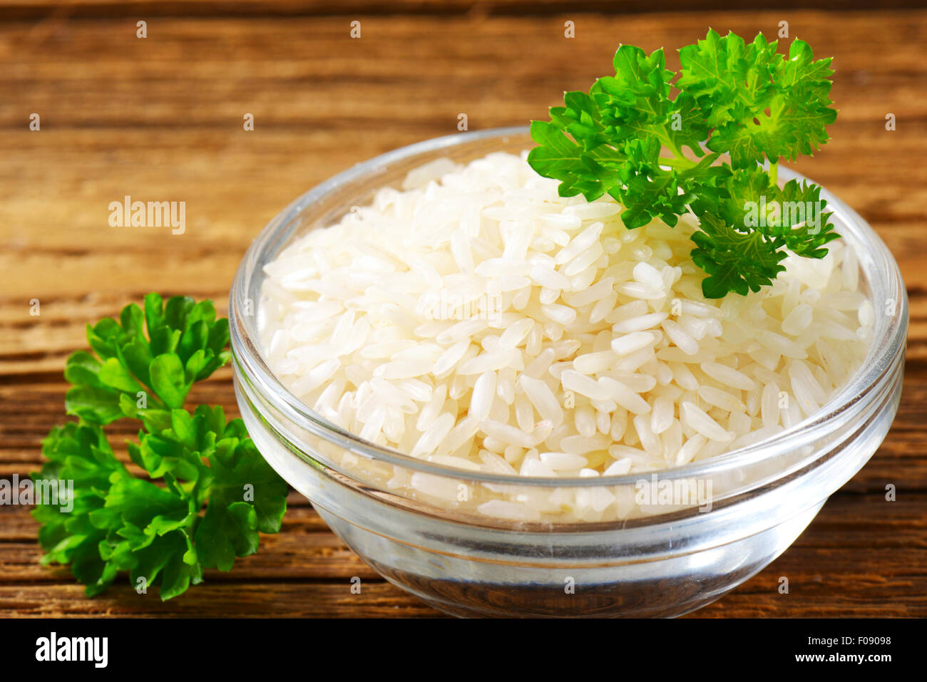 Bowl of uncooked white rice Stock Photo Alamy