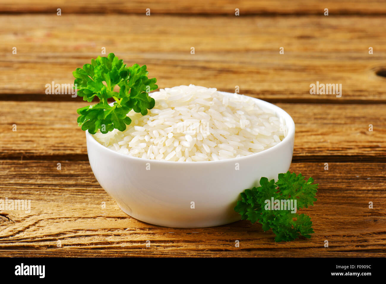 Bowl of uncooked white rice Stock Photo Alamy