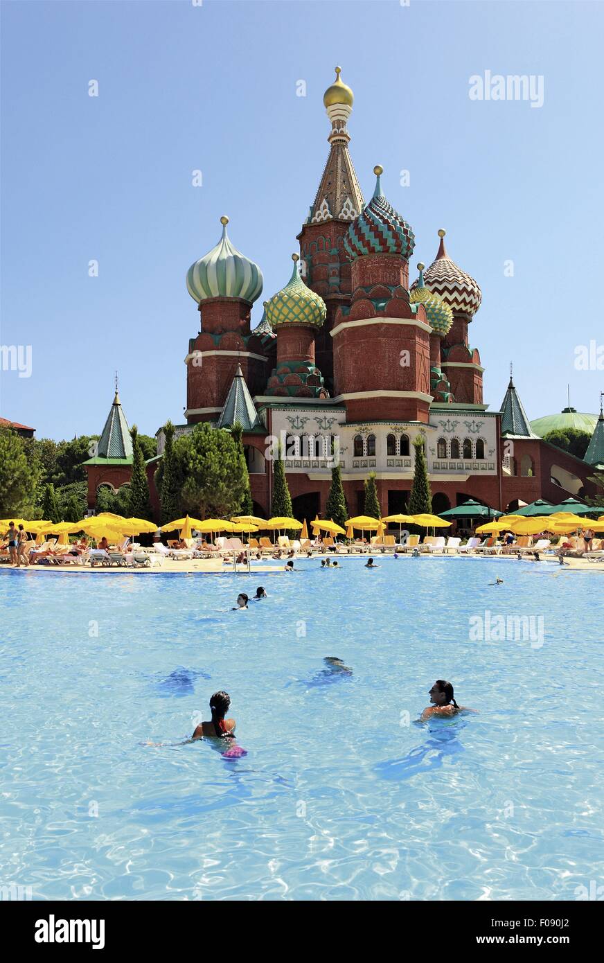 Tourists in pool with Hotel Kremlin Palace in background, Antalya, Turkey Stock Photo