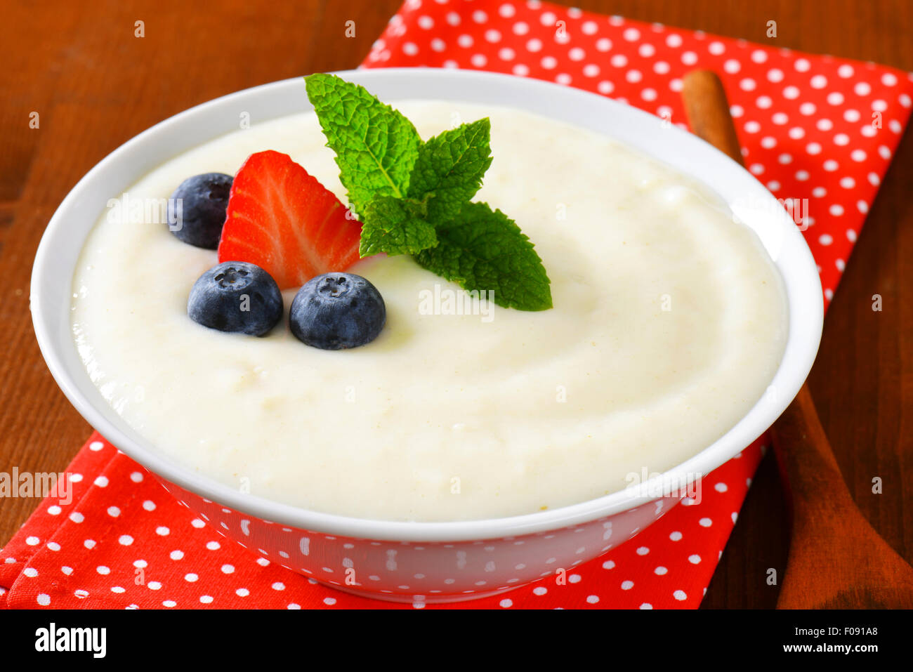 Smooth semolina porridge served with fresh fruit Stock Photo