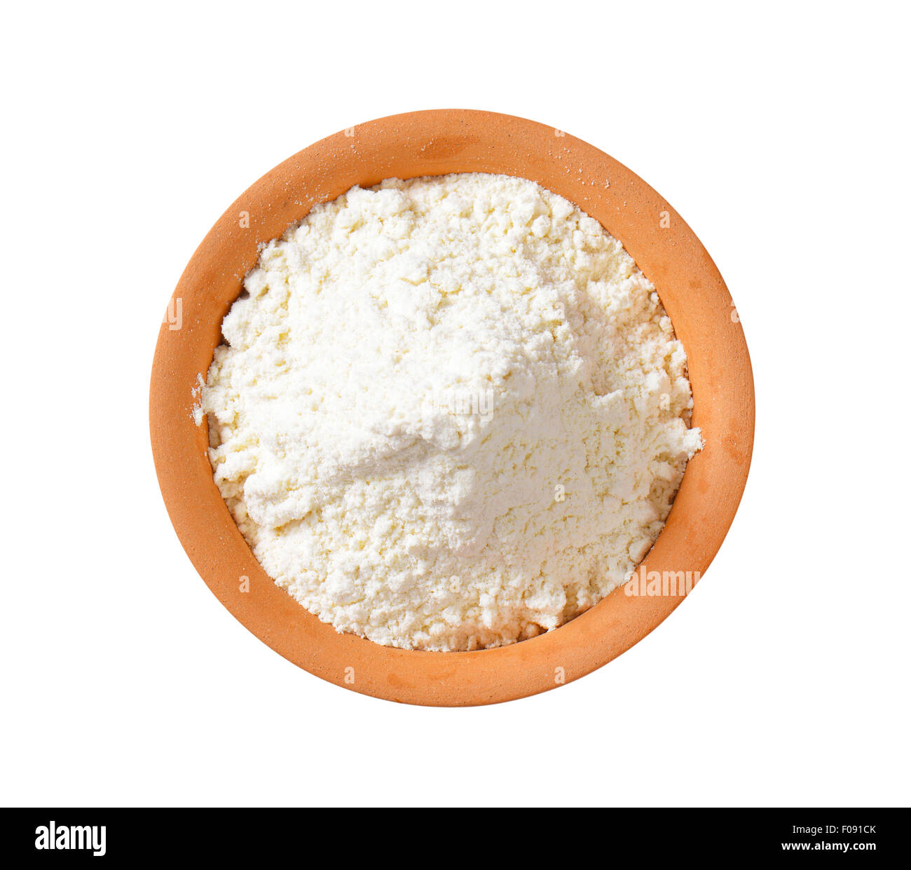 overhead view of finely ground flour in terracotta bowl Stock Photo