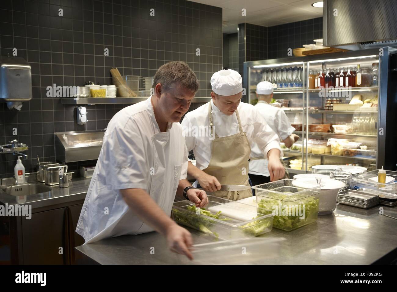 Mathias Dahlgren working with team in kitchen Super Snack Matbaren, Stockholm Stock Photo