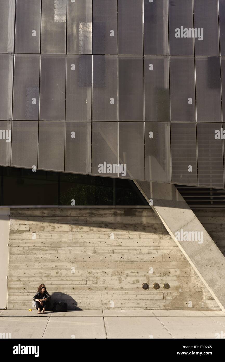 Siting Building Man sitting under Cooper Union building in East Village at New York ...