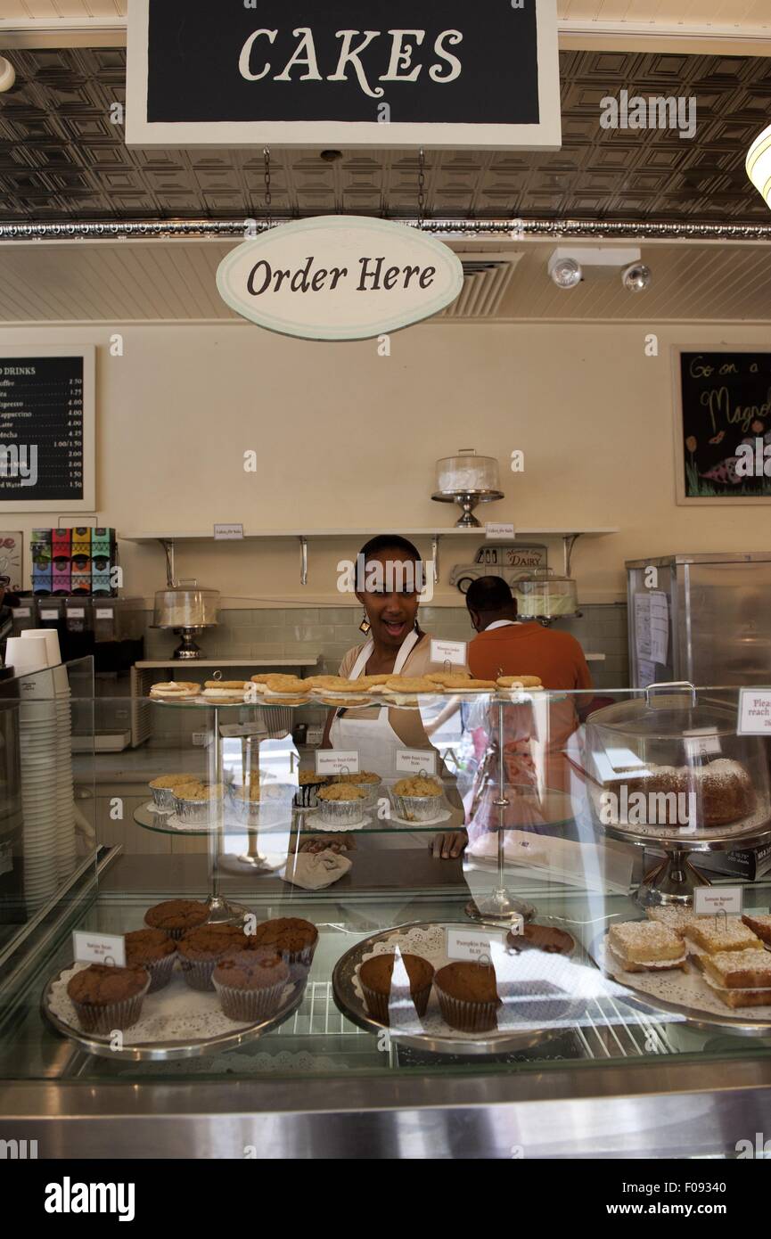 Waitress at counter in Magnolia Bakery, New York, USA Stock Photo - Alamy