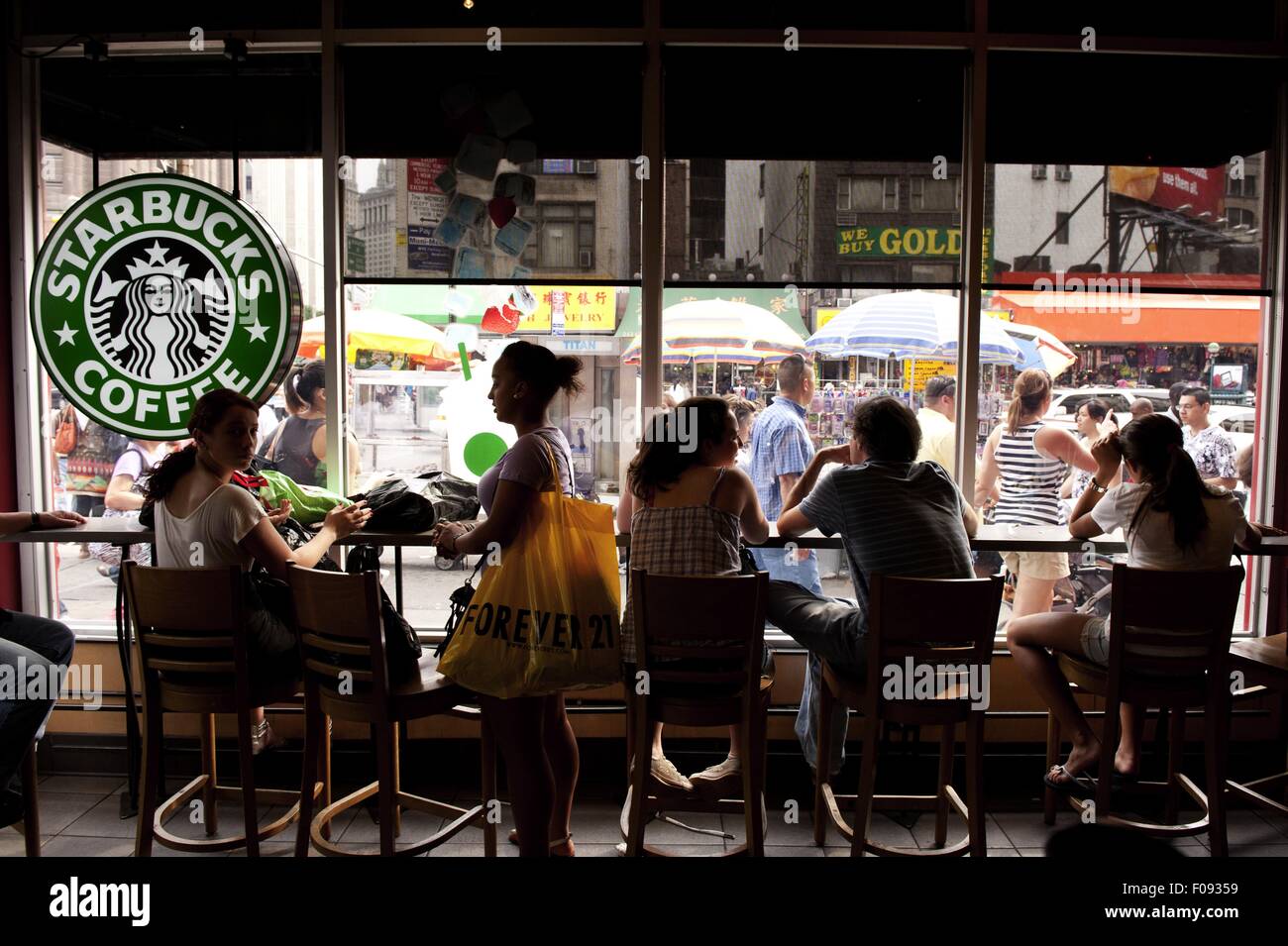 People sitting at starbucks in Chinatown, New York Stock Photo Alamy