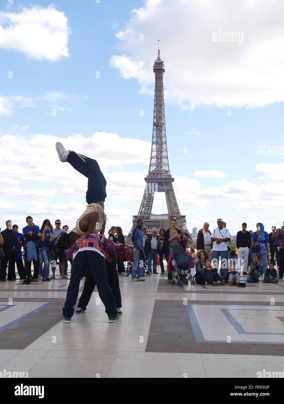 Street artists performing hip hop in front of Eiffel Tower, Paris, France Stock Photo
