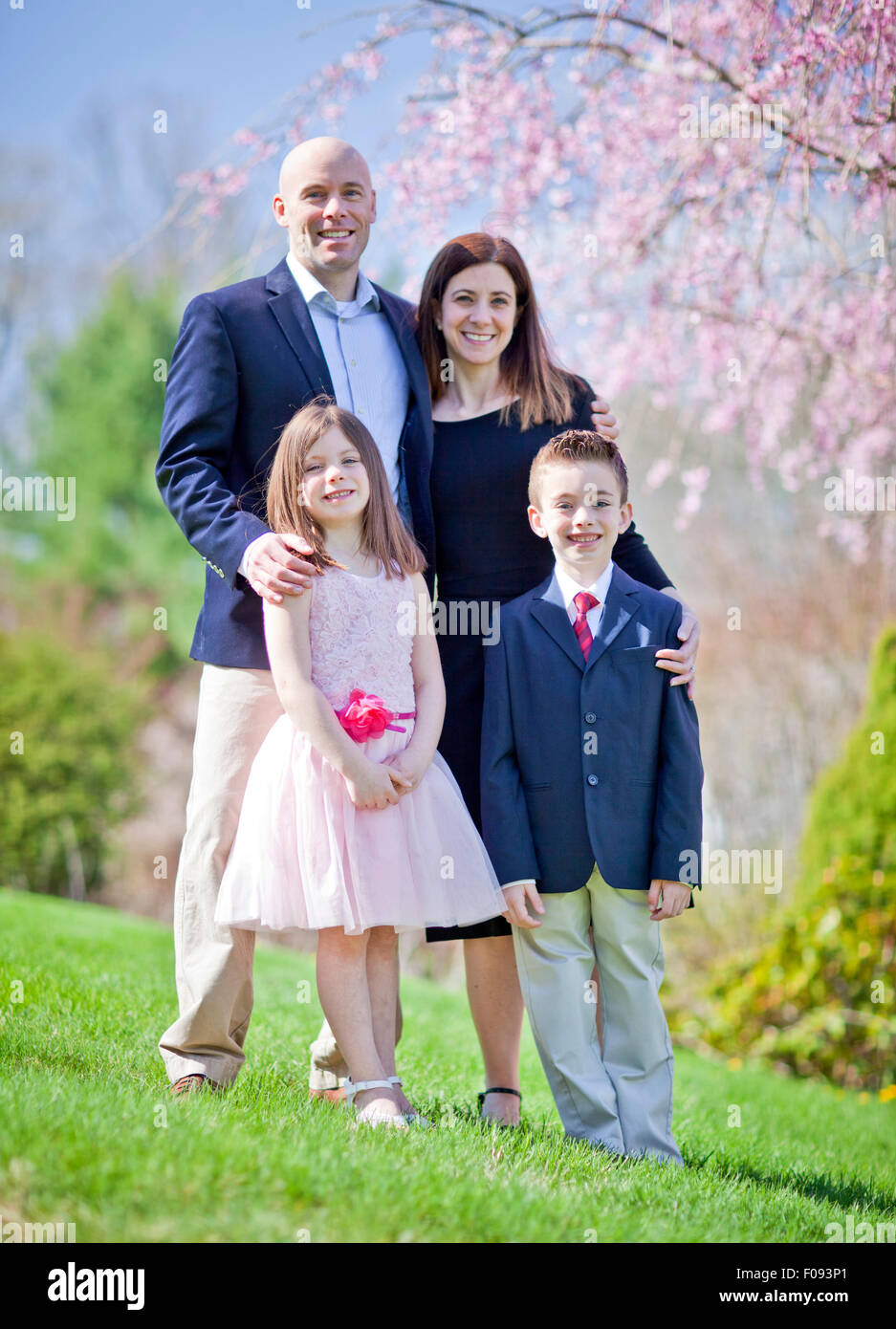 Family portrait during spring with selective focus on children Stock Photo