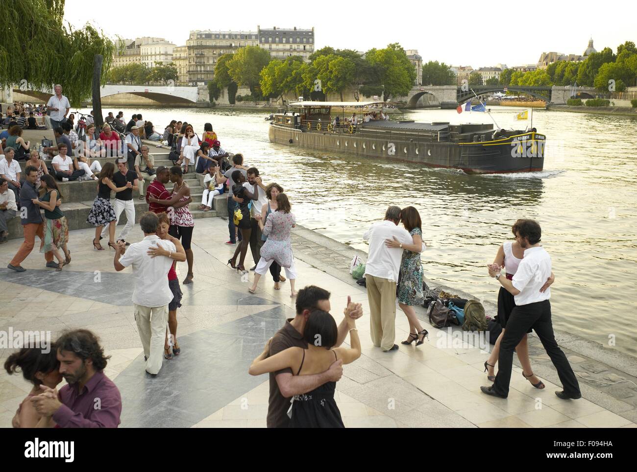 Paris Dancing Riverside Couple dancing at the bank of Seine River in Paris, France Stock Photo ...
