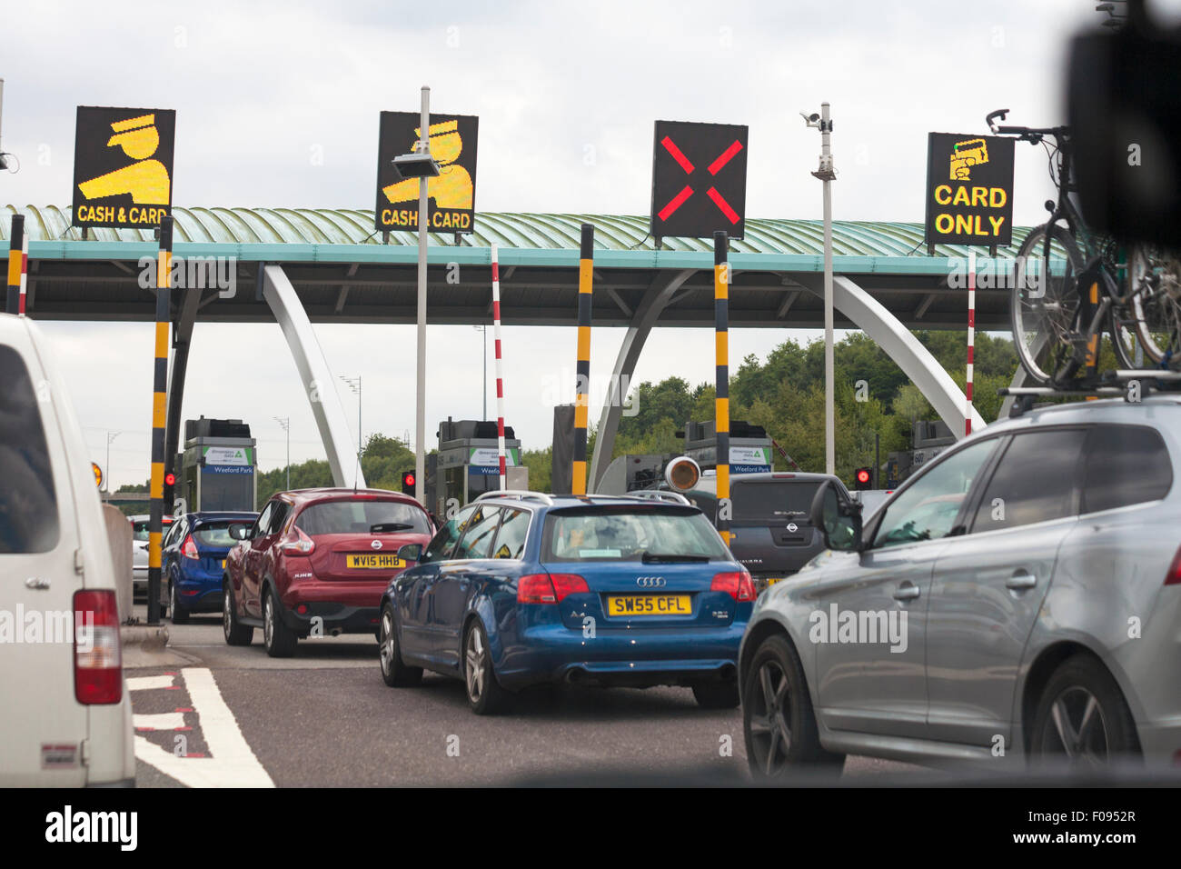 M6 toll road payment booths with cash & cards lanes or card only lane, Staffordshire Stock Photo