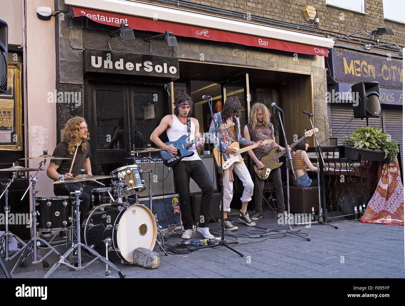 Music band performing outside Undersolo Restaurant in Camden Town
