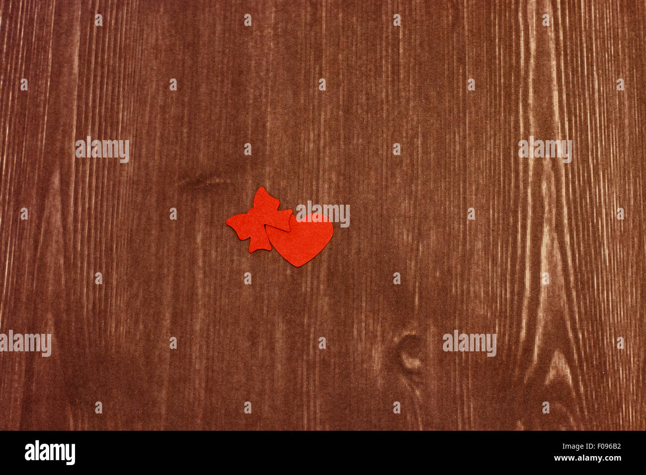 little red heart and a loop on a wood texture Stock Photo - Alamy