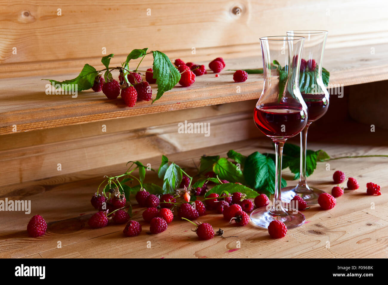 Wine Raspberry Leaves raspberry liqueur and ripe berries with leaves Stock Photo - Alamy