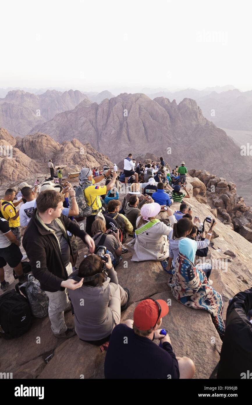 Pilgrims sitting on Mount sinai in Sinai Peninsula, Egypt Stock Photo