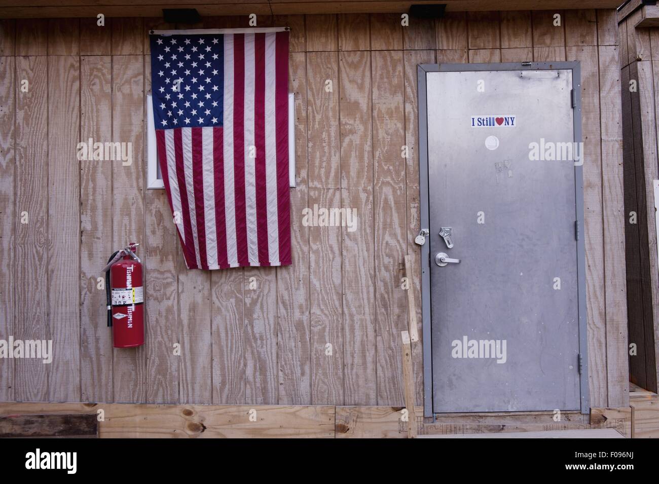 American flag hanging on construction shed in Ground Zero, New York, USA Stock Photo