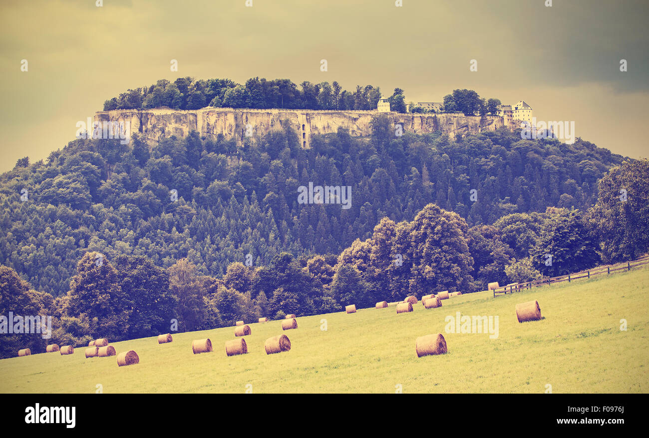 Retro toned landscape with fortress Koenigstein before rain, Germany. Stock Photo