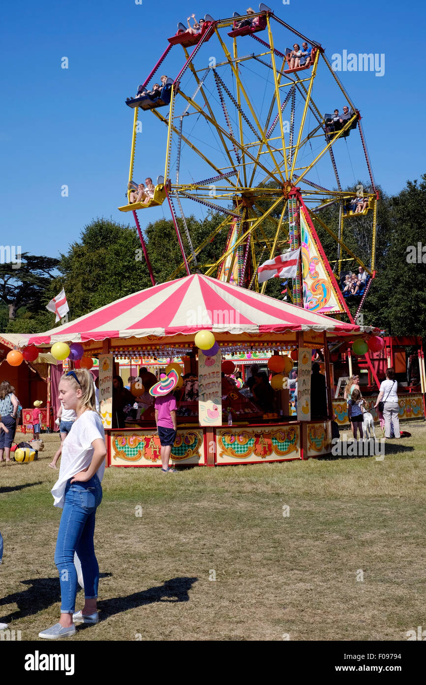 young female and big wheel at the chilli fiesta festival at west dean