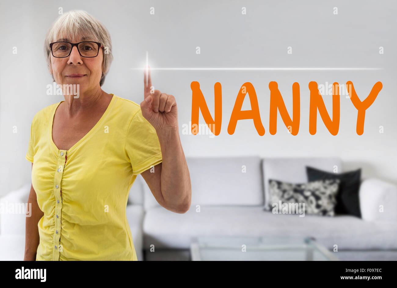 Nanny touchscreen is shown by senior. Stock Photo