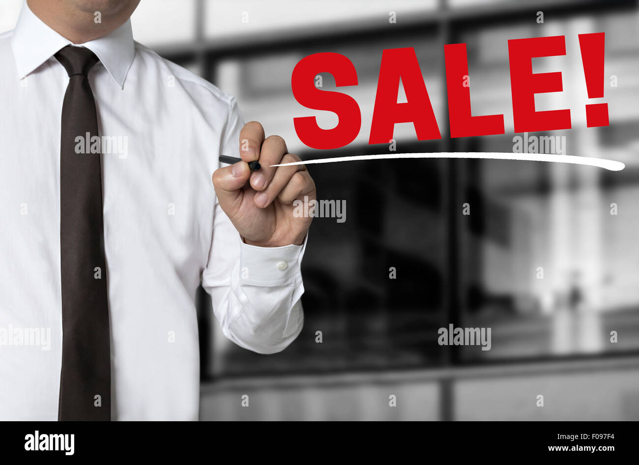 Sale is written by businessman background. Stock Photo