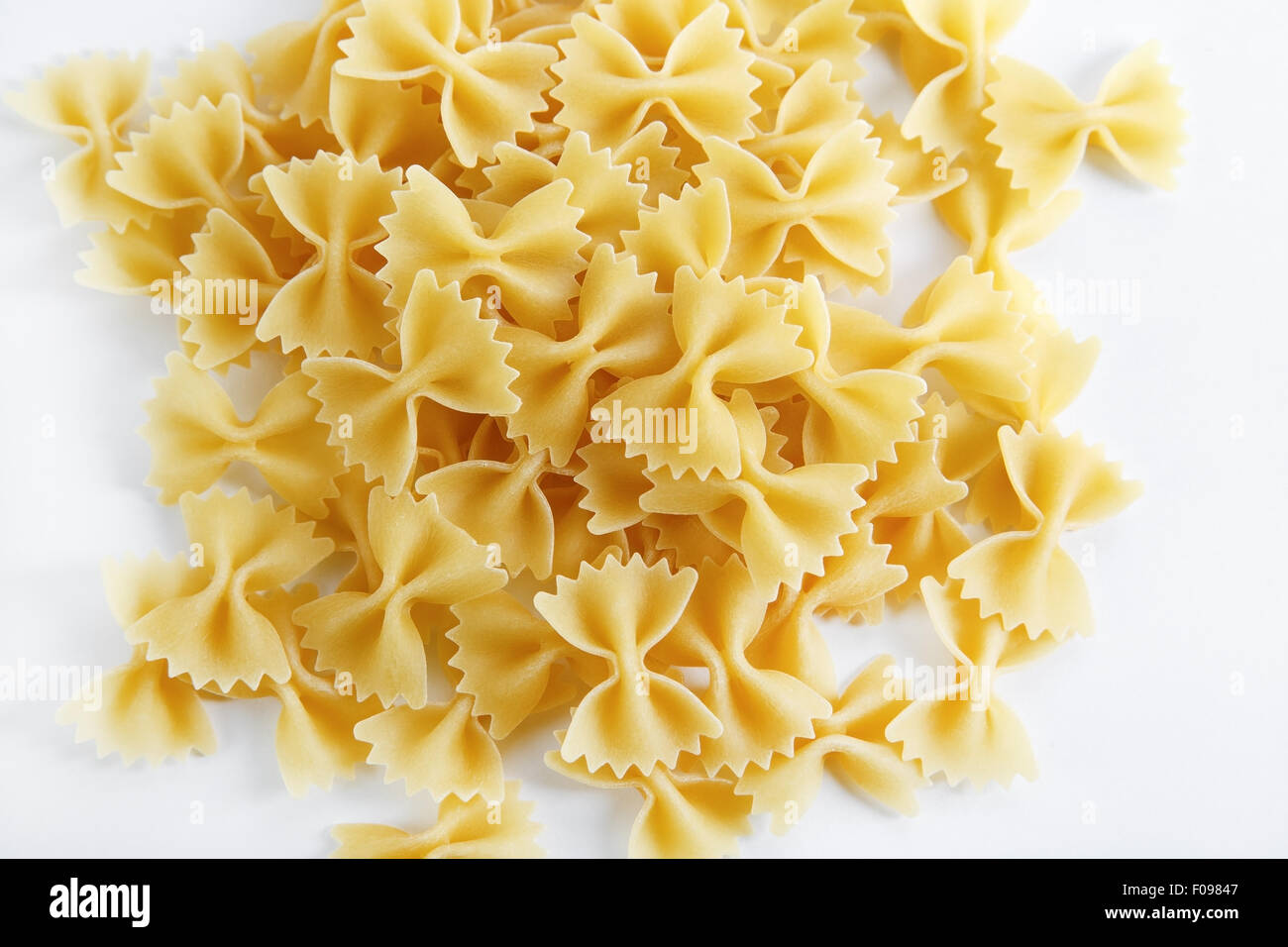 Uncooked italian bow tie pasta. Farfalle pasta Stock Photo Alamy