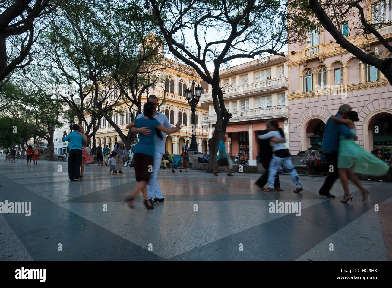 Horizontal view of Cubans dancing Tango in the street in Havana, Cuba. Stock Photo