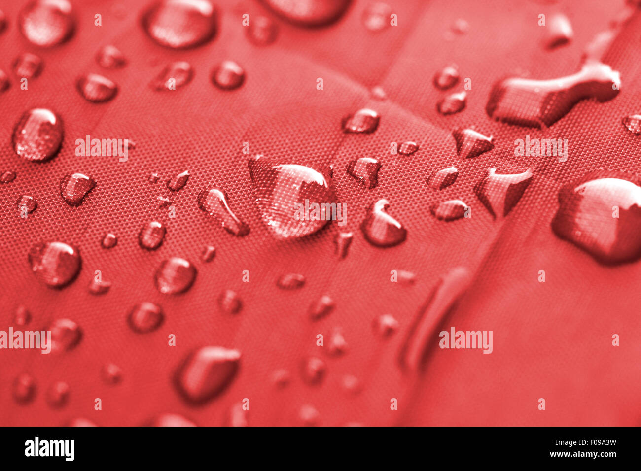 Closeup of rain drops on a water-repellent material Stock Photo