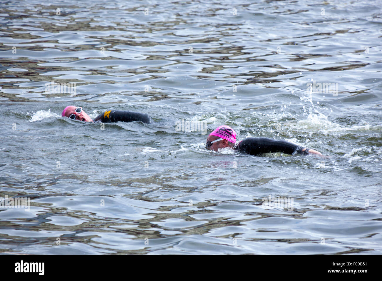 London, UK. 9 August 2015 -  The participants of the annual London Triathlon swim, cycle and run around Docklands in the eastern part of the capital. The world’s largest triathlon with its 13,000 participants, caters for all levels and abilities, and features Super-Sprint, Sprint, Olympic and Olympic Plus distances. Credit: Nathaniel Noir/Alamy Live News Stock Photo