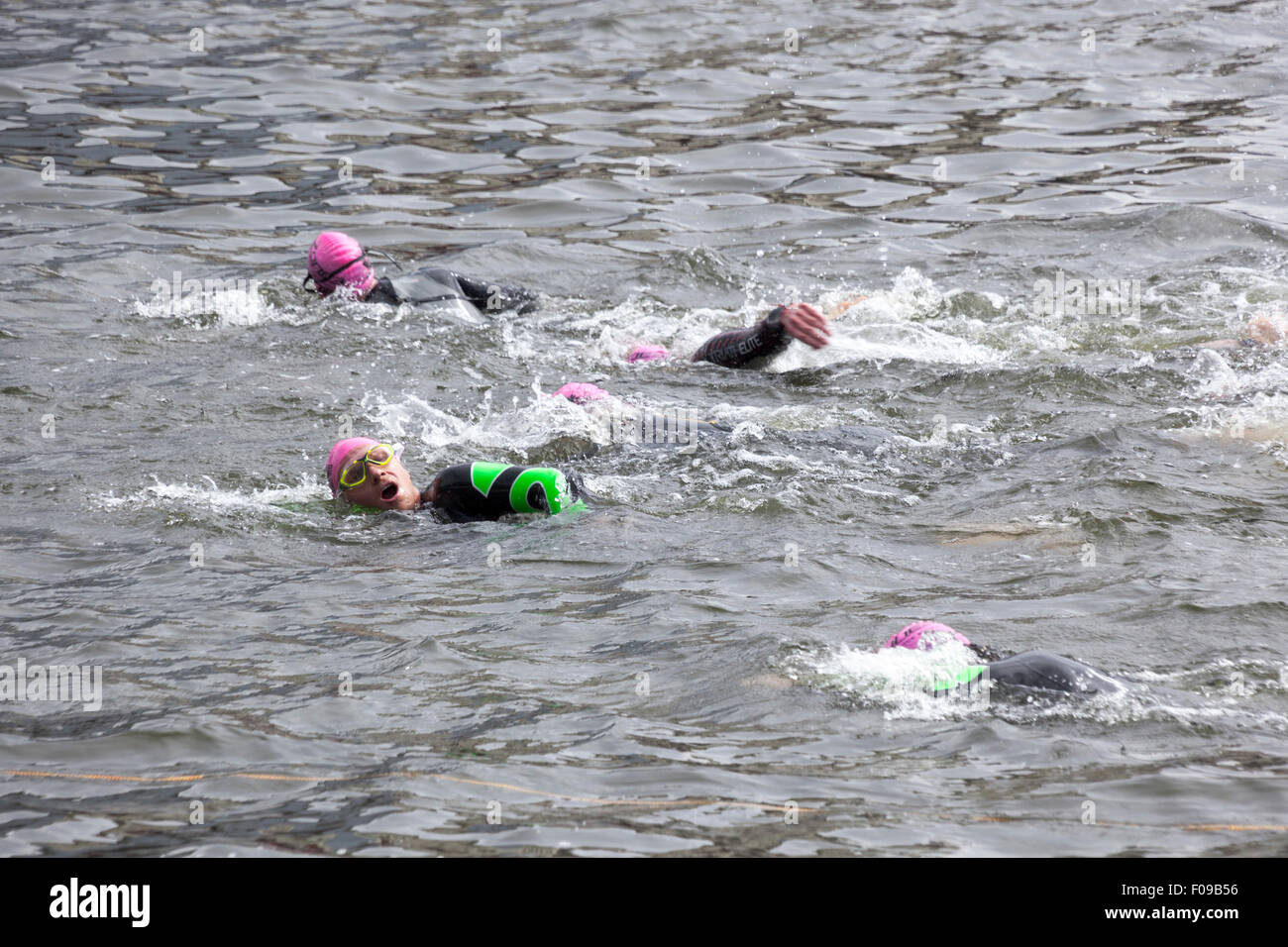 London, UK. 9 August 2015 -  The participants of the annual London Triathlon swim, cycle and run around Docklands in the eastern part of the capital.The world’s largest triathlon with its 13,000 participants, caters for all levels and abilities, and features Super-Sprint, Sprint, Olympic and Olympic Plus distances. Credit: Nathaniel Noir/Alamy Live News Stock Photo