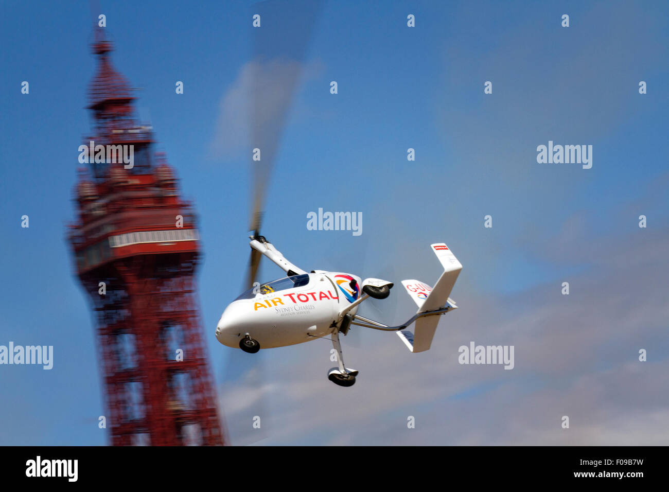 Ultralight aviation auto-gyro in Air Total flying past the tower at Blackpool's Air Show. Thousands of visitors to the resort were welcomed by beautiful blue skies & the beach glazed in August sunlight.  Credit:  Cernan Elias/Alamy Live News Stock Photo
